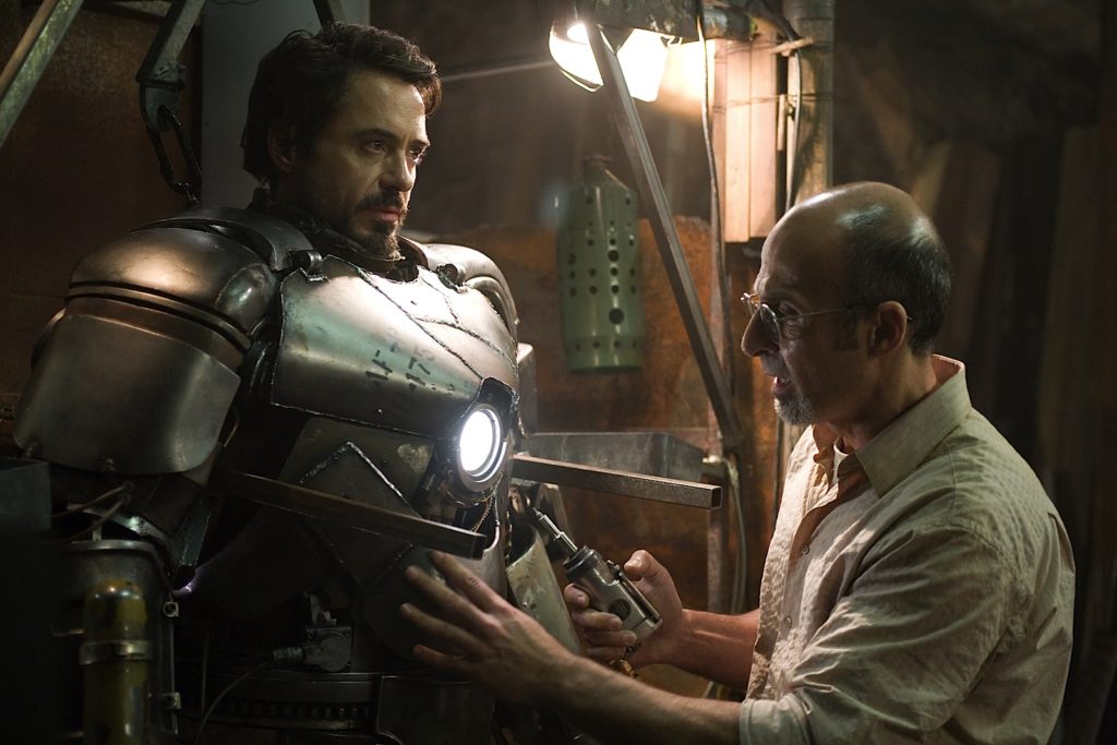 Iron Man. Plot summary and story structure. Yinsen helps Tony into his prototype Mark 1 suit.