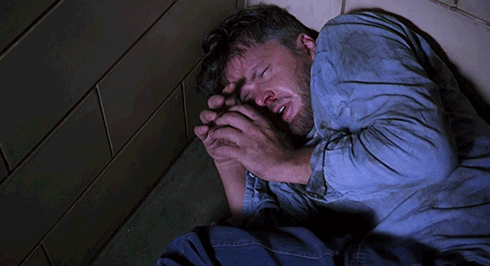 The Shawshank Redemption. Plot summary and story structure. Andy cowers in solitary confinement.